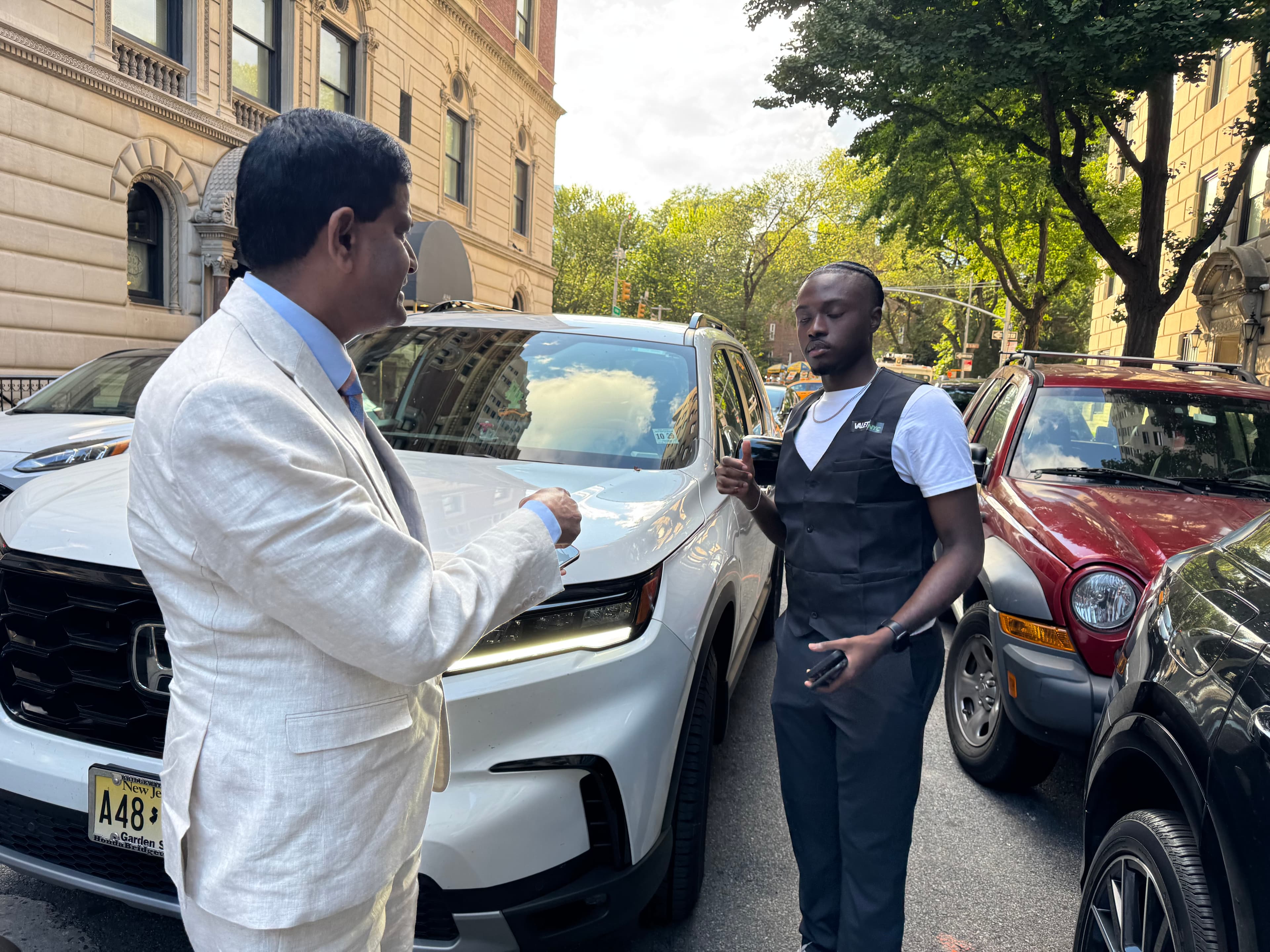 Valet Network valet receiving keys from a guest